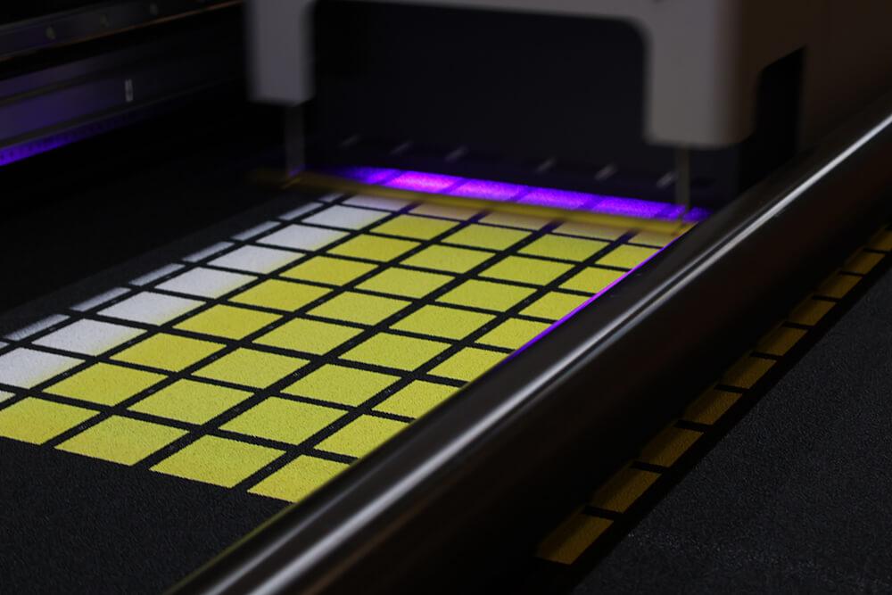 Bespoke Tape Being Printed with Yellow Colour Swatches on Black Non Slip Tape