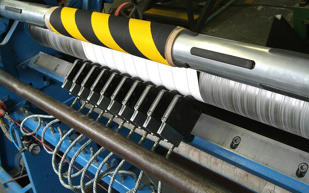 Black and Yellow Hazard Anti-Slip Material being Crush Cut into Rolls