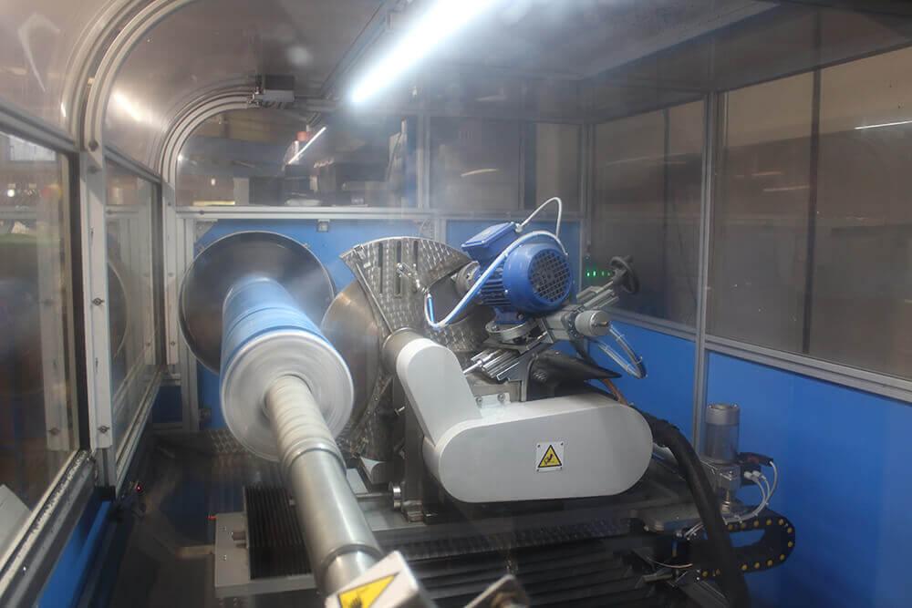 Cevenini Log Tape Slitter in Action Cutting Blue Line Marking Tape 2