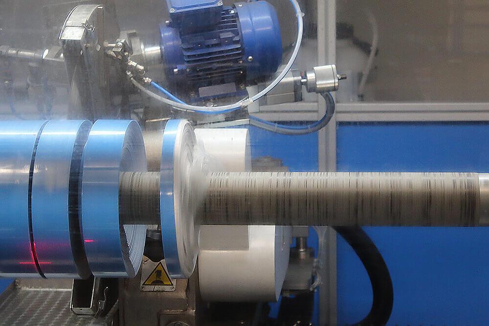 Cevenini Log Tape Slitter in Action Cutting Blue Line Marking Tape 3