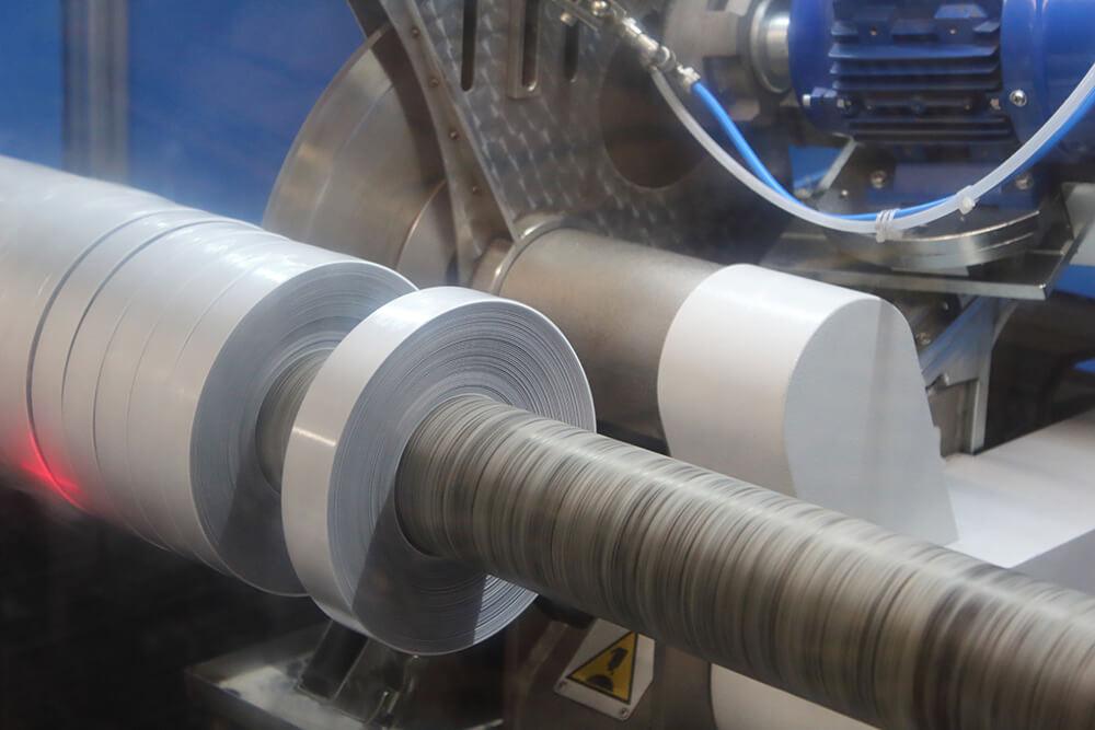 Cevenini Log Tape Slitter in Action Cutting Grey Anti Slip Tape