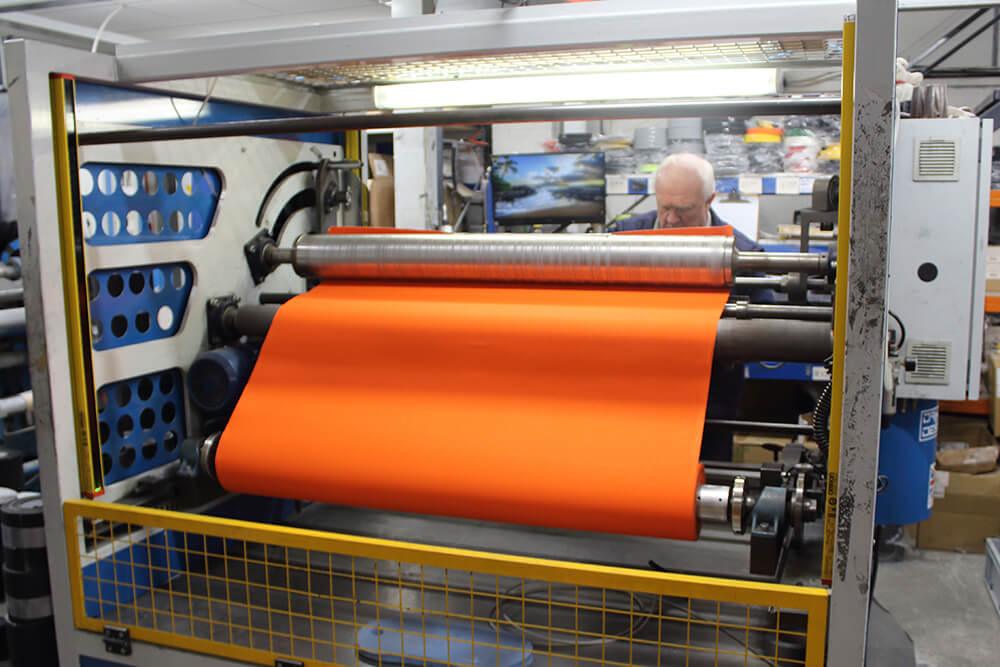 Orange Anti-Slip Material being Cut on a Crush Cutter into Rolls of Non Slip Tape 2