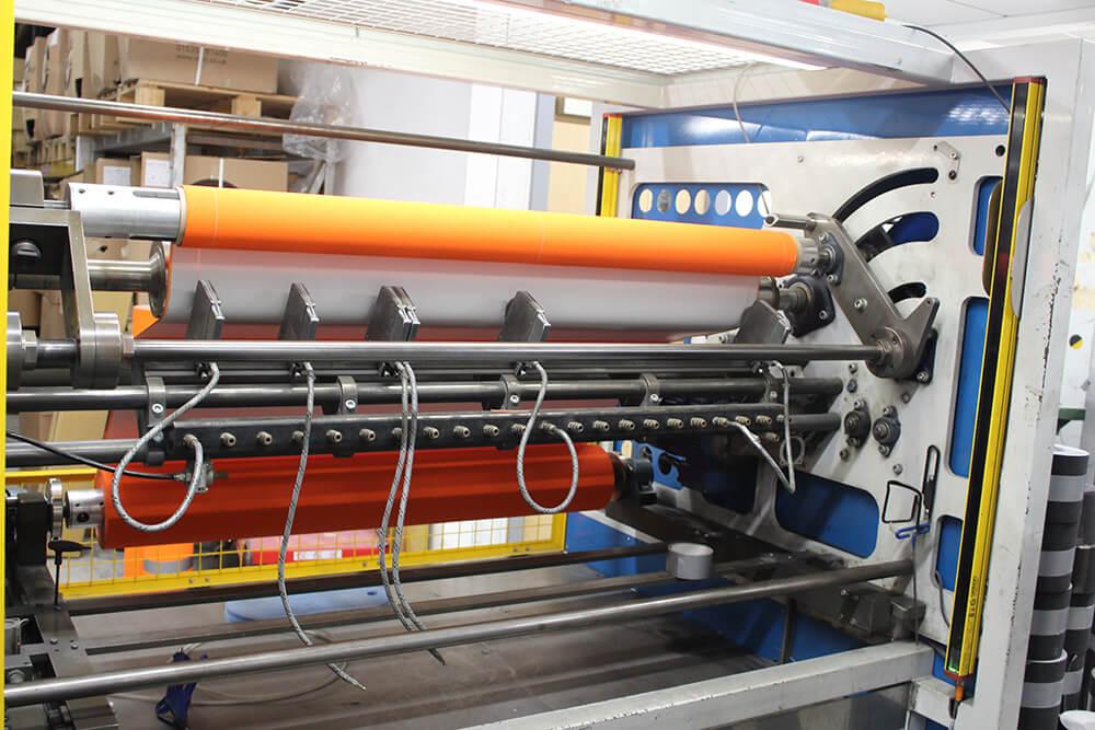 Orange Anti-Slip Material being Cut on a Crush Cutter into Rolls of Non Slip Tape