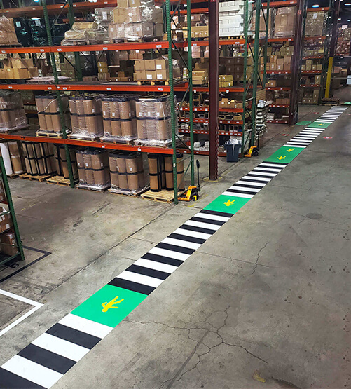 Marking Tape and Safety Floor Signage in Heskins LLC Warehouse